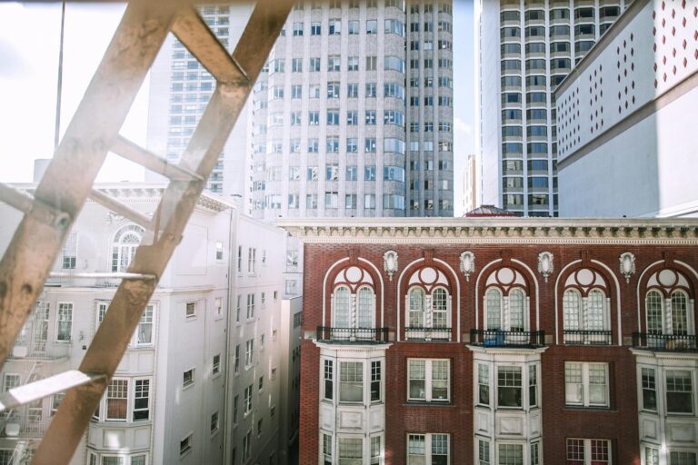 Fire Escape Ladder with Tall Buildings in Background